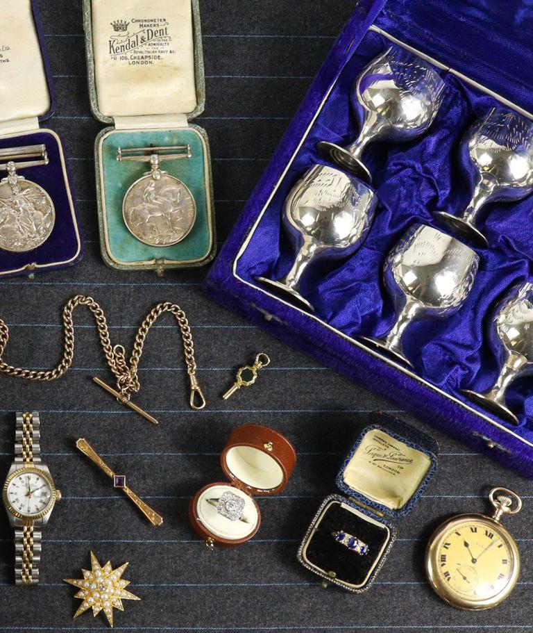 Cased silver goblets, medals and a pocket watch ready for auction